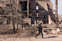 A man walks on the street of the city of Lyman, Ukraine. 06 Mar 2023