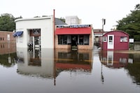 Tex Barry's Hot Dogs, at right, and surrounding businesses on County Street in Attleboro, Mass. remain closed due to flooding from heavy rain Tuesday, Sept. 12, 2023. (Mark Stockwell/The Sun Chronicle via AP)