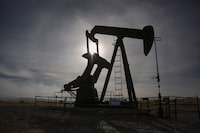 A pumpjack works at a well head on an oil and gas installation near Cremona, Alta., Saturday, Oct. 29, 2016. Enerplus Corp. says it is shutting down wells and again cutting its capital spending plans for 2020 due to low oil prices linked to measures taken to control the COVID-19 pandemic. THE CANADIAN PRESS/Jeff McIntosh