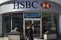 A woman walking past an HSBC bank on Spadina Ave. in Toronto's Chinatown on April 9 2014. (Fred Lum/The Globe and Mail)