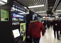 People walk past Presto machines underground in the TTC subway portals in Toronto on December 4, 2018. THE CANADIAN PRESS/Nathan Denette