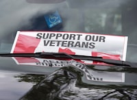 A sign is placed on a truck windshield as members of the advocacy group Banished Veterans protest outside the Veterans Affairs office in Halifax on Thursday, June 16, 2016. One of Canada's largest veterans' organizations is urging the federal government to automatically approve the roughly 44,000 outstanding applications for disability benefits from injured veterans to help them better deal with the COVID-19 crisis. THE CANADIAN PRESS/Andrew Vaughan