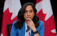 President of the Treasury Board Anita Anand listens to a reporter ask their question during a news conference, Tuesday, October 24, 2023 in Ottawa.  THE CANADIAN PRESS/Adrian Wyld