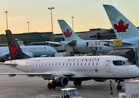Air Canada planes are seen at the gates at Montréal-Pierre Elliott Trudeau International Airport in Dorval, Quebec on April 2.
