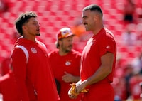 KANSAS CITY, MISSOURI - SEPTEMBER 24: Patrick Mahomes #15 of the Kansas City Chiefs and Travis Kelce #87 of the Kansas City Chiefs warms up prior to a game against the Chicago Bears at GEHA Field at Arrowhead Stadium on September 24, 2023 in Kansas City, Missouri. (Photo by David Eulitt/Getty Images)