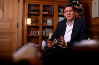 Premier David Eby is photographed during a year-end interview from his office at the legislature in Victoria, B.C., on Thursday, December 21, 2023. THE CANADIAN PRESS/Chad Hipolito
