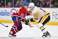 MONTREAL, CANADA - DECEMBER 13: Cole Caufield #22 of the Montreal Canadiens and Drew O'Connor #10 of the Pittsburgh Penguins skate against each other during the second period at the Bell Centre on December 13, 2023 in Montreal, Quebec, Canada.  (Photo by Minas Panagiotakis/Getty Images)