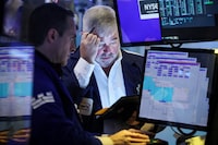 Traders work on the floor at the New York Stock Exchange (NYSE) in New York City, U.S., March 7.