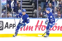 Toronto Maple Leafs' William Nylander (left) celebrates his goal against the Detroit Red Wings with Mitchell Marner during first period NHL preseason hockey action in Toronto, on Thursday, October 5, 2023.THE CANADIAN PRESS/Chris Young