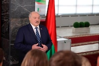 In this photo provided by the Belarusian Presidential Press Service, Belarus President Alexander Lukashenko addresses the  media after voting, at a polling station in Minsk, Belarus, on Sunday, Feb. 25, 2024. Lukashenko was believed a few years ago to be considering whether to lead the new body after stepping down, but his calculus has apparently changed, and he announced on Sunday that he will run in next year's presidential election. (Belarusian Presidential Press Service via AP)