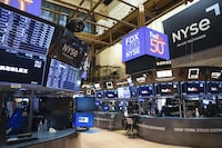 Traders work on the floor at the New York Stock Exchange in New York, Monday, April 17.