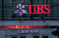 FILE PHOTO: Logos of Swiss banks Credit Suisse and UBS are seen before a news conference in Zurich Switzerland, August 30, 2023.  REUTERS/Denis Balibouse/File Photo