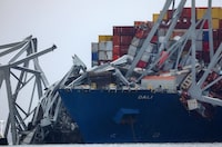 FILE PHOTO: Wreckage lies across the deck of the Dali cargo vessel, which crashed into the Francis Scott Key Bridge causing it to collapse, in Baltimore, Maryland, U.S., March 27, 2024. REUTERS/Mike Segar/File Photo