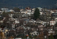 Houses are seen on a hill in Vancouver, on Thursday, Nov. 23, 2023. The BC Real Estate Association says there was a nearly 30 per cent increase in home sales last month compared with January 2023. THE CANADIAN PRESS/Darryl Dyck