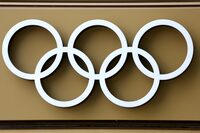FILE PHOTO: The Olympics rings are seen on the Pulse building, the headquarters of the Paris 2024 Olympics organizing committee, as a police search is currently underway, in Saint-Denis near Paris, France, June 20, 2023. REUTERS/Stephanie Lecocq/File Photo