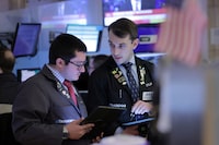 Traders work on the trading floor at the New York Stock Exchange (NYSE) in New York City, U.S., April 5, 2024. REUTERS/Andrew Kelly/File Photo