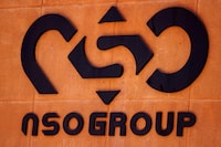 FILE PHOTO: The logo of Israeli cyber firm NSO Group is seen at one of its branches in the Arava Desert, southern Israel July 22, 2021. REUTERS/Amir Cohen
