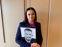 Sviatlana Tsikhanouskaya, exiled Belarusian opposition leader, holds a photo of her husband in Ottawa on April 15, 2024.