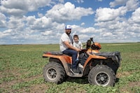 Ryan Christianson, who recently switched internet service from Xplore Inc., formerly Xplornet, to Starlink, Elon Musk’s internet venture, and his son Carter sit for a photograph at this farm near Wadena, SK, June 23, 2023.

Photo Liam Richards for the Globe and Mail