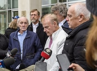 Robert Mailman, left, and Walter Gillespie, speak to media shortly after their hearing at Saint John Law Courts in Saint John, N.B., January 4, 2024. More than a month after they were declared innocent, lawyers for two New Brunswick men say they are in negotiations with the provincial government for compensation. THE CANADIAN PRESS/Michael Hawkins