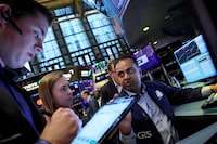 Traders work on the floor of the New York Stock Exchange (NYSE) in New York City, U.S., July 12.