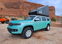The Vacationeer concept has a hardshell rooftop sleeper and comes in a distinctive spearmint colour with woodgrain accents.