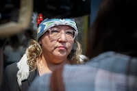 Manitoba regional chief Cindy Woodhouse has announced her candidacy in the upcoming Assembly of First Nations national chief election. Woodhouse speaks to media a she arrives at the Canadian premiers and National Indigenous Organizations meeting in Winnipeg, Monday, July 10, 2023. THE CANADIAN PRESS/John Woods