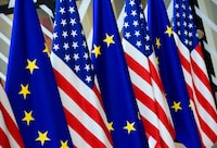 (FILES) In this file photo taken on May 15, 2017 in Brussels shows US and European Union flags at the EU headquarters. - Democratic lawmakers on January 14, 2019 demanded that the Trump administration explain a downgrade in status to the European Union mission in Washington, calling the quietly implemented decision insulting and counterproductive. Twenty-seven members of the new Democratic majority in the House of Representatives asked Secretary of State Mike Pompeo to provide answers by January 30, saying they were "deeply troubled" by the move and that Congress was not consulted. (Photo by JOHN THYS / AFP)JOHN THYS/AFP/Getty Images