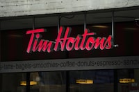 Tim Hortons signage is pictured in Ottawa on Wednesday Sept. 7, 2022. The master franchisee of Tim Hortons coffee shops in China says it has entered into a transaction for the exclusive development of Popeyes in mainland China and Macau.THE CANADIAN PRESS/Sean Kilpatrick