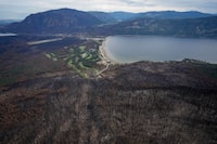 Trees burned by the Bush Creek East Wildfire are seen above Little Shuswap Lake in Squilax, B.C., Monday, Sept. 11, 2023. The BC Wildfire Service has announced a five-month open fire ban covering much of the province's Interior, as fire season gets off to an early start. THE CANADIAN PRESS/Darryl Dyck