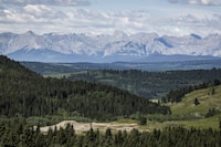 A section of the eastern slopes of the Canadian Rockies is seen west of Cochrane, Alta., Thursday, June 17, 2021. A joint federal-provincial review has denied an application for an open-pit coal mine in Alberta's Rocky Mountains, saying its impacts on the environment and Indigenous rights aren't worth the economic benefits it would bring. THE CANADIAN PRESS/Jeff McIntosh