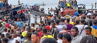 Passengers of the boat capsized on the Congo river late on Friday stand in Mbandaka, Democratic Republic of Congo, on Oct.14.