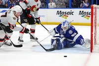 TAMPA, FL - APRIL 11: Matt Tomkins #90 of the Tampa Bay Lightning makes a save against Shane Pinto #57 of the Ottawa Senators during the third period at the Amalie Arena on April 11, 2024 in Tampa, Florida. (Photo by Mike Carlson/Getty Images)