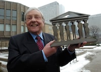 Feb. 22, 2007  --   Roy McMurtry, who is retiring as the Chief Justice is photographed with  a maquette of the piece which is called Pillars of Justice in Toronto, Ont. Feb. 22/2007. The sculpture is dedicated  in honour of McMurtry, who is retiring as the Chief Justice of the Ontario Court of Appeals.

February 22, 2007
Photo by Kevin Van Paassen
