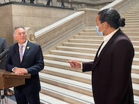 Alan Lagimodiere, left, Manitoba's minister for Indigenous reconciliation and northern relations, is confronted by Opposition NDP Leader Wab Kinew, right, shortly after being sworn in to cabinet at the Manitoba legislature in Winnipeg on Thursday, July 15, 2021. Manitoba's new minister for Indigenous relations has issued an apology as the government continues to deal with the fallout from Premier Brian Pallister's remarks on Canadian history. THE CANADIAN PRESS/Steve Lambert