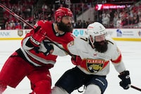 May 18, 2023; Raleigh, North Carolina, USA; Carolina Hurricanes defenseman Brent Burns (8) and Florida Panthers defenseman Radko Gudas (7) skate during the second overtime period of game one in the Eastern Conference Finals of the 2023 Stanley Cup Playoffs at PNC Arena. Mandatory Credit: James Guillory-USA TODAY Sports