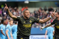 FILE - PSG's Kylian Mbappe celebrates after scoring his side's opening goal during the French League One soccer match between Troyes and Paris Saint Germain, at the Stade de l'Aube, in Troyes, France, Sunday, May 7, 2023. Saudi Arabian soccer team Al-Hilal has made a record $332 million bid for France striker Kylian Mbappe. Paris Saint-Germain has confirmed the offer and says it has given Al-Hilal permission to open negotiations directly with Mbappe. (AP Photo/Lewis Joly, File)