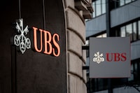 Signs of Swiss bank giant UBS bank are seen in Basel, on April 4, 2023 on the eve of the general meeting of shareholders following the takeover by UBS of Credit Suisse hastily arranged by the Swiss government on March 19, 2023 to prevent a financial meltdown. (Photo by Fabrice COFFRINI / AFP) (Photo by FABRICE COFFRINI/AFP via Getty Images)