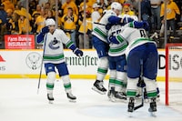 NASHVILLE, TENNESSEE - MAY 03: The Vancouver Canucks celebrate after defeating the Nashville Predators in Game Six to win the Western Conference First Round Playoffs at Bridgestone Arena on May 03, 2024 in Nashville, Tennessee.  (Photo by Brett Carlsen/Getty Images)