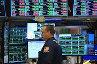 A trader works on the floor of the New York Stock Exchange (NYSE) during morning trading on March 4.