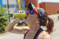 Athletic Brewery non alcoholic beer mile   in Toronto on August 19, 2023. Blacktoe running group drinking non-alcoholic drinks from Athletic Brewing