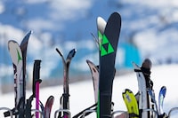 Pas de la Casa, Andorra, December 08 2019: Close-up on a ski rack at the terrace of a café boarding the ski slope of Grandvalira, the largest ski resort in the Pyrenees and southern Europe.