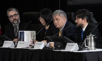 Association of Families of Flight PS752 representative Hamed Esmaeilion (left), Falun Dafa Association of Canada's Grace Dai Wollensak, and Uyghur Rights Advocacy Project's Mehmet Tohti listen to Russian Canadian Democratic Alliance's Yuriy Novodvorskiy (right) at the Public Inquiry Into Foreign Interference in Federal Electoral Processes and Democratic Institutions, Wednesday, March 27, 2024, in Ottawa.