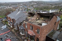 Damaged houses are seen in the Stalybridge area of Greater Manchester People after a "localised tornado" ripped off roofs and brought down walls as Storm Gerrit continued to impact the country, Manchester, England, Thursday, Dec. 28, 2023. (AP Photo/Jon Super)
