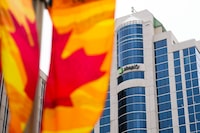 A class action lawsuit is accusing Shopify Inc. of reneging on a deal it offered employees laid off in a recent round of cuts. Shopify Inc. headquarters signage in Ottawa on Tuesday, May 3, 2022.  THE CANADIAN PRESS/Sean Kilpatrick