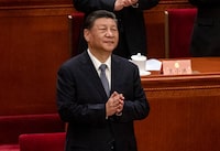 BEIJING, CHINA - MARCH 4: Chinese President Xi Jinping clasps his hands as he stands at the opening session of the CPPCC, or Chinese Peoples Political Consultative Conference, at the Great Hall of the People on March 4, 2024 in Beijing, China.China's annual political gathering known as the Two Sessions will convene leaders and lawmakers to set the government's agenda for domestic economic and social development for the year.  (Photo by Kevin Frayer/Getty Images)