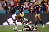 Colombia's forward #18 Linda Caicedo (L) is tackled by Germany's forward #09 Svenja Huth (R) during the Australia and New Zealand 2023 Women's World Cup Group H football match between Germany and Colombia at Sydney Football Stadium in Sydney on July 30.