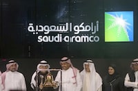 FILE - Saudi Arabia's state-owned oil company Aramco and stock market officials celebrate the debut of Aramco's initial public offering on the Riyadh Stock Market, in Riyadh, Saudi Arabia, Dec. 11, 2019. Saudi Arabia's crown prince transferred another 8% of shares in the kingdom's oil giant Saudi Aramco to the country's prominent sovereign wealth fund Thursday, March 7, 2024, shares worth some $160 billion. (AP Photo/Amr Nabil, File)