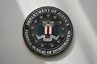 FILE - An FBI seal is seen on a wall on Aug. 10, 2022, in Omaha, Neb. A senior FBI official says the agency is concerned by the potential that foreign adversaries could deploy artificial intelligence as a way to interfere in American elections and spread disinformation. (AP Photo/Charlie Neibergall, File)