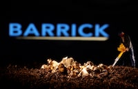 FILE PHOTO: A small toy figure and gold imitation are seen in front of the Barrick logo in this illustration taken November 19, 2021. REUTERS/Dado Ruvic/Illustration/File Photo